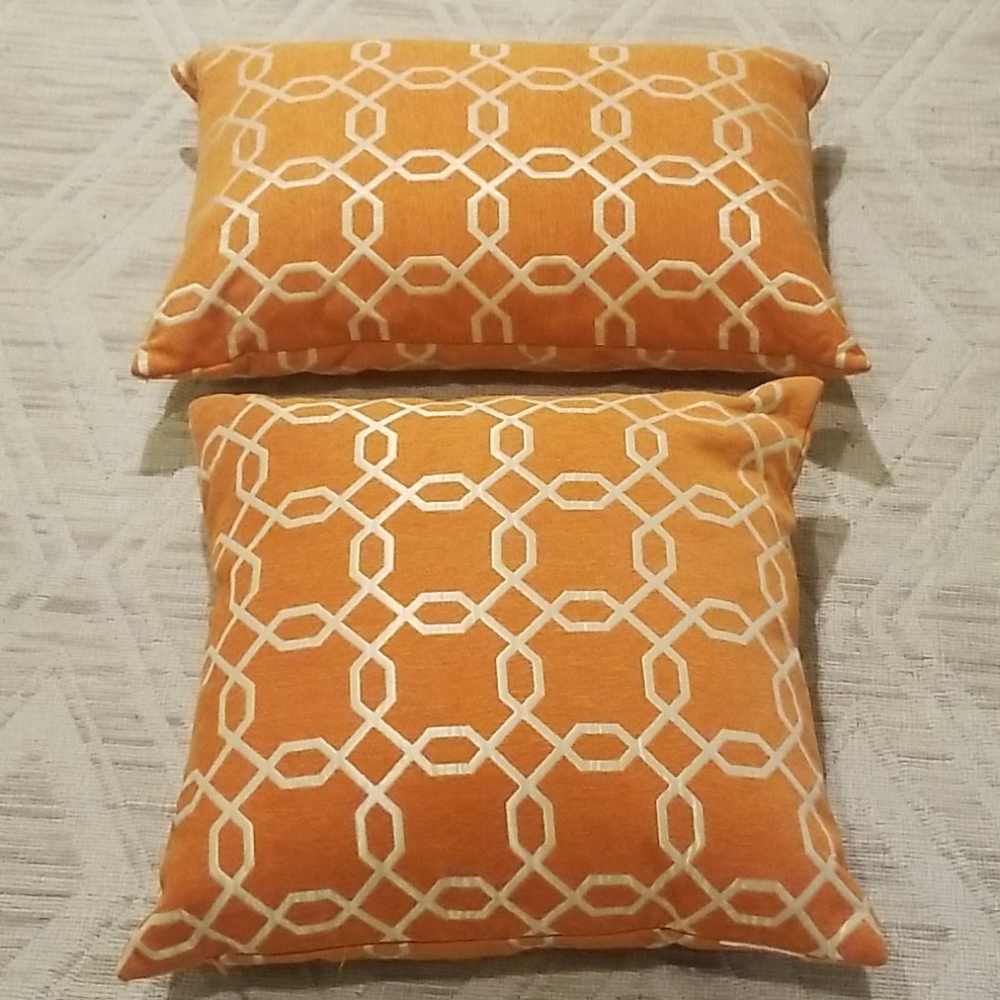 2 large orange pillows with zipper